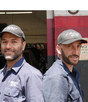 The M Fast Auto crew in shop shirts and caps